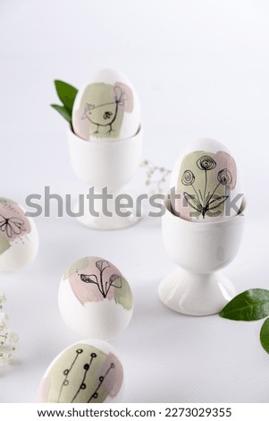  Modern hand painted easter egg on white background.