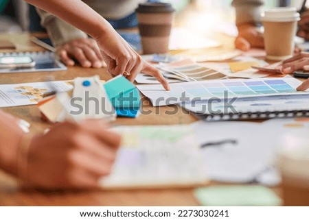 Color, creative meeting and hands of business people on desk for branding design, strategy and marketing logo. Teamwork, palette project and designers brainstorming ideas, thinking and planning