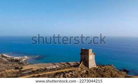 Photo of a tower with sea in Sicily 
