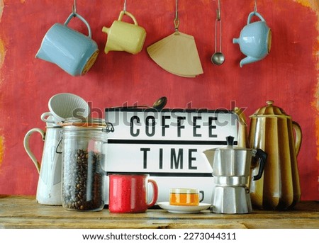 Vintage coffee pots, cups and coffee makers with illuminated sign and slogan Coffee time. Cafe, Restaurant or Coffee concept