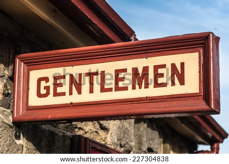 Retro style "Gentlemen" toilet sign at an old railway station.