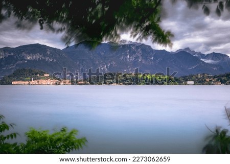 Bellagio skyline view from Lake Como at golden sunset, northern Italy, long exposure