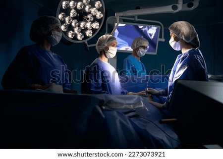 Man under anesthesia lies on the operating table Royalty-Free Stock Photo #2273073921