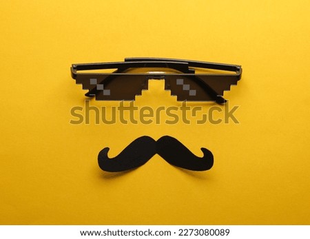 Face from pixel glasses with a mustache on a yellow background. Creative layout. Father's Day.