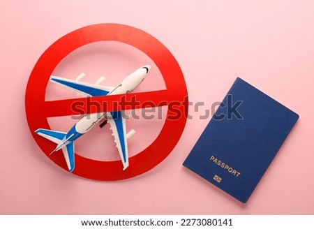 Flight ban. Passenger plane with passport and prohibition sign on pink background Royalty-Free Stock Photo #2273080141