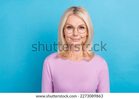 Photo of charming pretty blonde hairstyle woman entrepreneur wear stylish eyeglasses good vision isolated on aquamarine color background