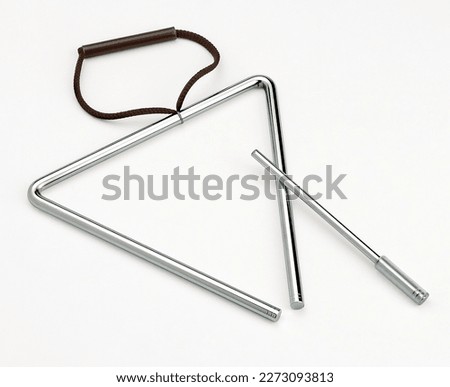 Musical instrument triangle on white background  Royalty-Free Stock Photo #2273093813