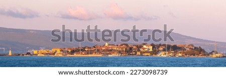 Wide sunset panorama of an Old City of Nessebar, Bulgaria from the sea