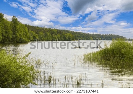 Beautiful view of two canoes on lake on beautiful bright day. Sweden. Europe. 