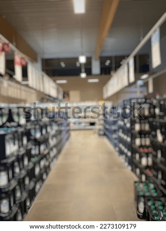 Defocused picture of drinks section at market. Blurred. Out of focus.