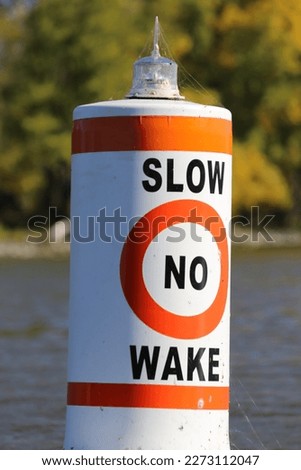 Slow no wake buoy on a lake