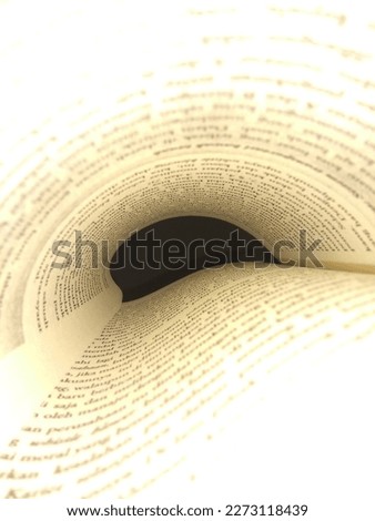 photo of a book and paper