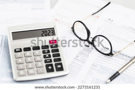 Individual income tax return form for tax payment on working desk. Background for Data analysis, paperwork, financial research, report. Calculation tax return in 2023