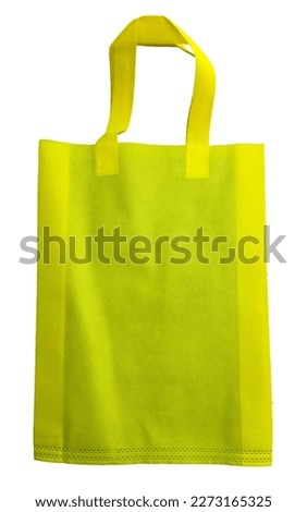 a yellow non-woven fabric tote bag isolated by a white background. eco-friendly bag made of polypropylene