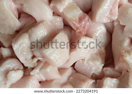 Close up of pork fat.Blood lipids are fatty substances carried in the bloodstream. High levels of LDL cholesterol and triglycerides increase the risk of heart disease. Royalty-Free Stock Photo #2273204191