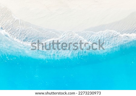 Aerial view with beach in wave of  turquoise sea water shot, Top view of beautiful white sand background 