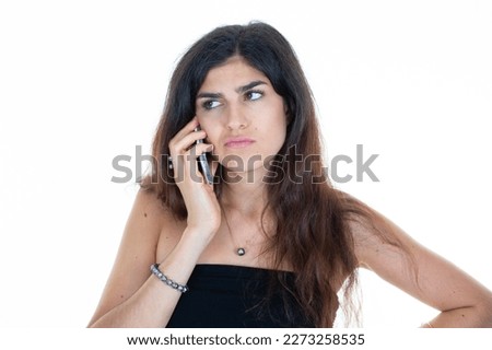 pretty young woman talking on cell smartphone phone on white background