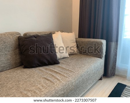 gray sofa chair On a wooden floor, bright and comfortable, leaving room, living room Royalty-Free Stock Photo #2273307507