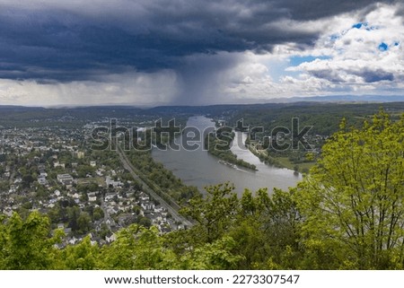 Heavy rainfall over the Rhine, view from the mountain "Drachenfels" in Koenigswinter, North Rhine-Westphalia, Germany Royalty-Free Stock Photo #2273307547