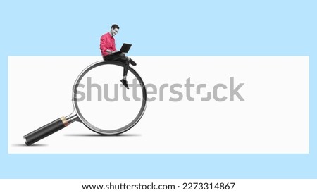 A man with a laptop is sitting on a big magnifying glass. Art collage. Searching for information on the internet concept. Royalty-Free Stock Photo #2273314867
