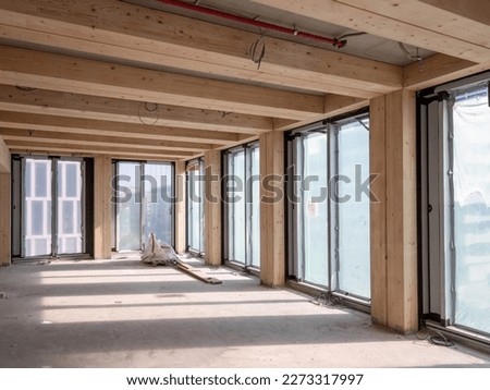 construction site of a sustainable Timber-concrete composite office building Royalty-Free Stock Photo #2273317997
