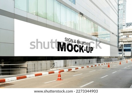 Mockup blank large horizontal outdoors billboard on the wall of building near walkway, empty space for insert your advertising show in public area, 