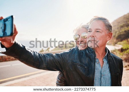 Senior biker couple, road trip selfie and smile with sunglasses, love and romance on vacation in nature. Elderly lady, happy and travel with old man, profile picture and smile for social network app