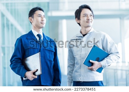 Two Japanese men wearing work clothes Royalty-Free Stock Photo #2273378451