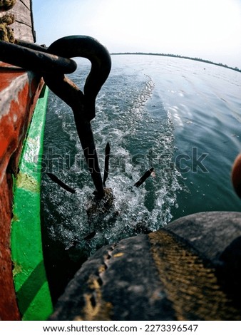 boat ride on the bay of Bengal, with a picture of an anchor making waves 