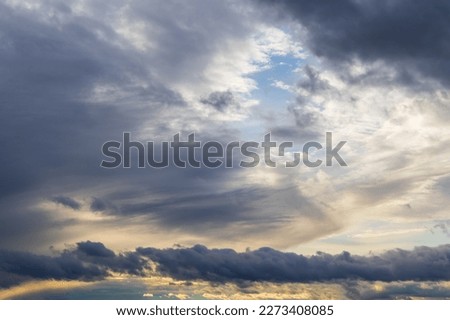Sky with dramatic clouds. The sun shines through the clouds. The sky for exchange in the photo.
