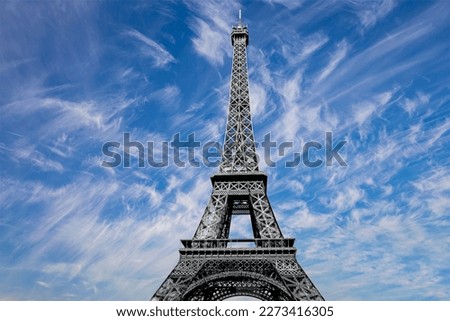 Eiffel Tower against the background of a beautiful sky with clouds. Paris, France 
