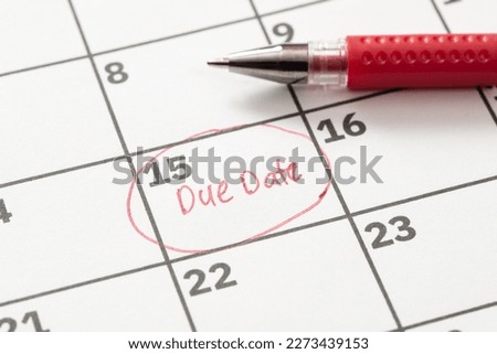 Due date reminder written on calendar in red marker Royalty-Free Stock Photo #2273439153
