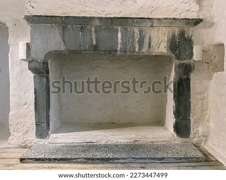 Stone fireplace in Aughnanure Castle