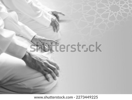 	
A man sits on a prayer mat with the text al adha on the right islamic ramadan kareem greeting Royalty-Free Stock Photo #2273449225