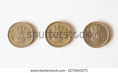 Vintage to new coin. Indian Currency. Back side - 5 RS Coin Indian 1900-2015. Royalty-Free Stock Photo #2273463375