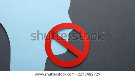 Paper cut face silhouette with prohibition sign on gray background. Prohibition of freedom of speech, censorship Royalty-Free Stock Photo #2273482929