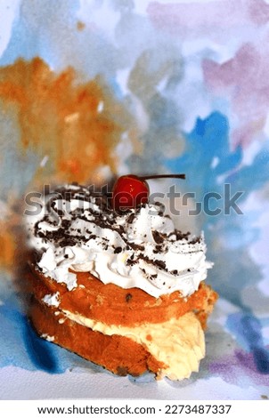 A cake is depicted in an artistic style on watercolor paper