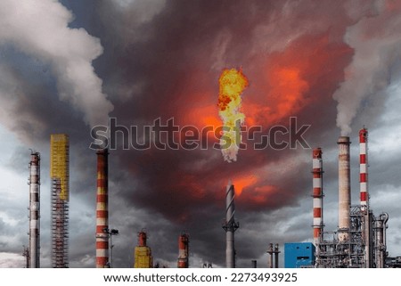 Large oil refinery complex, with chimneys and towers Royalty-Free Stock Photo #2273493925