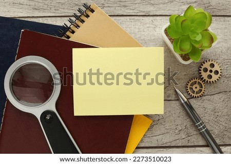 Label sticker on wooden background on notepad. Business discussion, teamwork, brainstorming concept