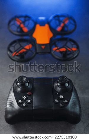 Quadcopter drone with joystick control and blue neon backlight