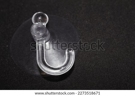 Plastic hook with suction cup for fixing Royalty-Free Stock Photo #2273518671