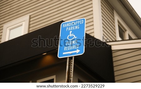 Handicap sign showing reserved street parking symbolizing disability and mobility problems showing accessibility and safety 