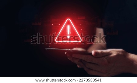 Caution concept. The person is holding a tablet with a sign Royalty-Free Stock Photo #2273533541
