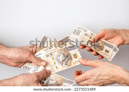 Hands of a man and a woman exchanging money. Banknotes on a white background. Counting money.