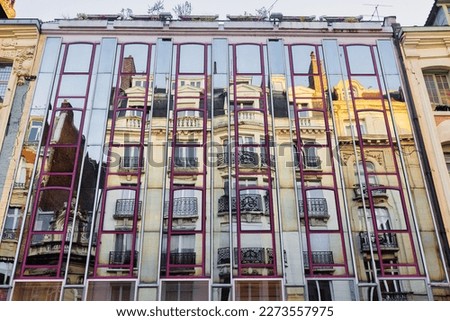 picture of an old building reflecting in a mirror facade in Lille, France