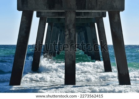Underneath the pier water splashing