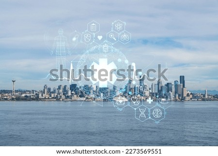 Seattle skyline with waterfront view. Skyscrapers of financial downtown at day time, Washington, USA. Health care digital medicine hologram. The concept of treatment and disease prevention