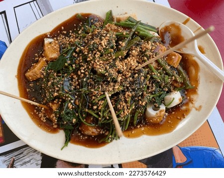 Asian Food.Yong Tau Foo Hakka Chinese Hawker local food in Malaysia. closeup image . Yong Tau Foo served with sweet sauce and made by various fish cake and vegetable. Royalty-Free Stock Photo #2273576429
