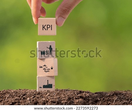 KPI Eco energy saving concept text on wooden box with green BG Royalty-Free Stock Photo #2273592273