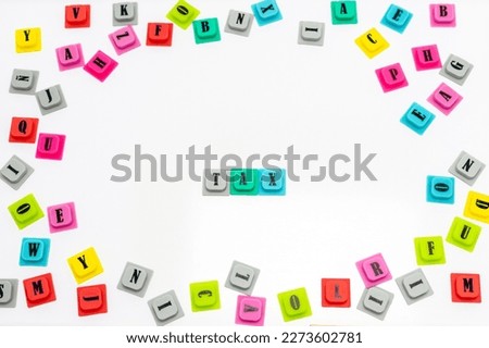 Word TAX made up with a colorful letters on white isolated background. Tax Concept.